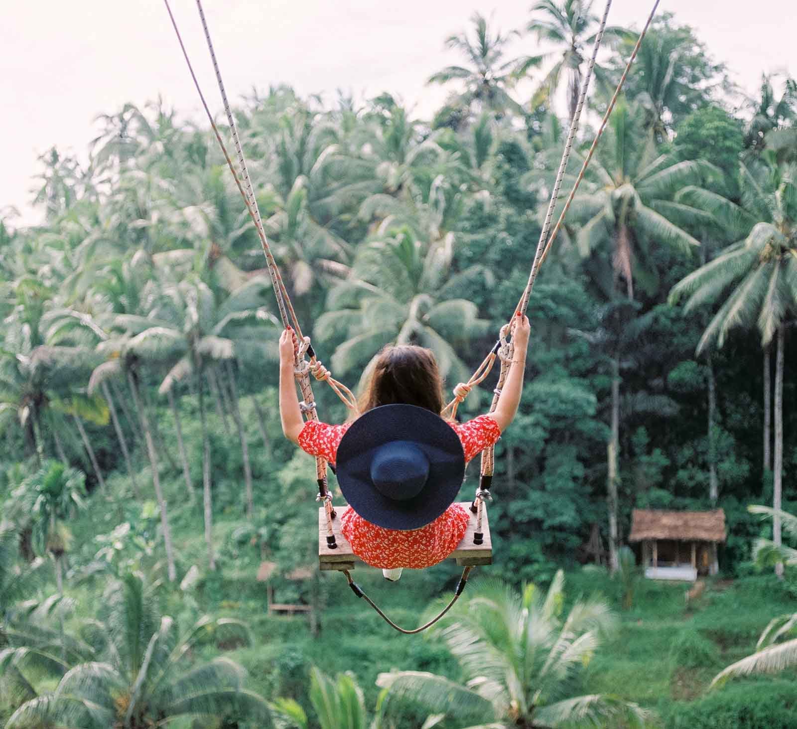 girl on swing in forest