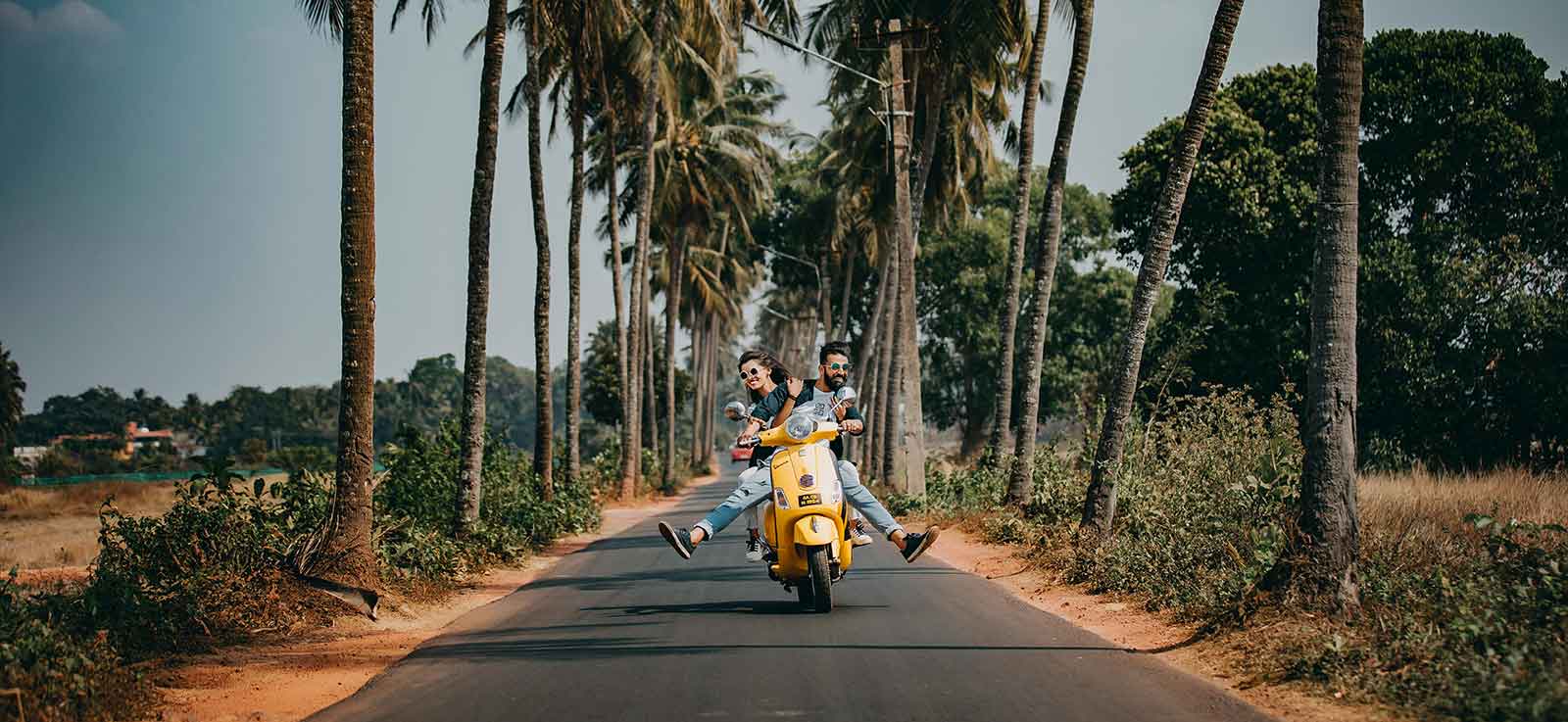 Couple riding scooter